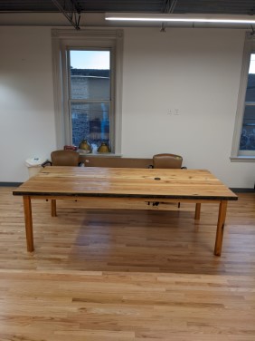 view of table in front of office windows